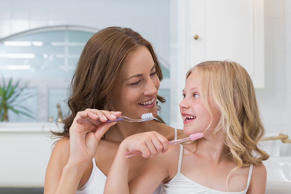 mom and daughter brushing teeth Willow Creek Dental Idaho Falls, ID Terreton ID